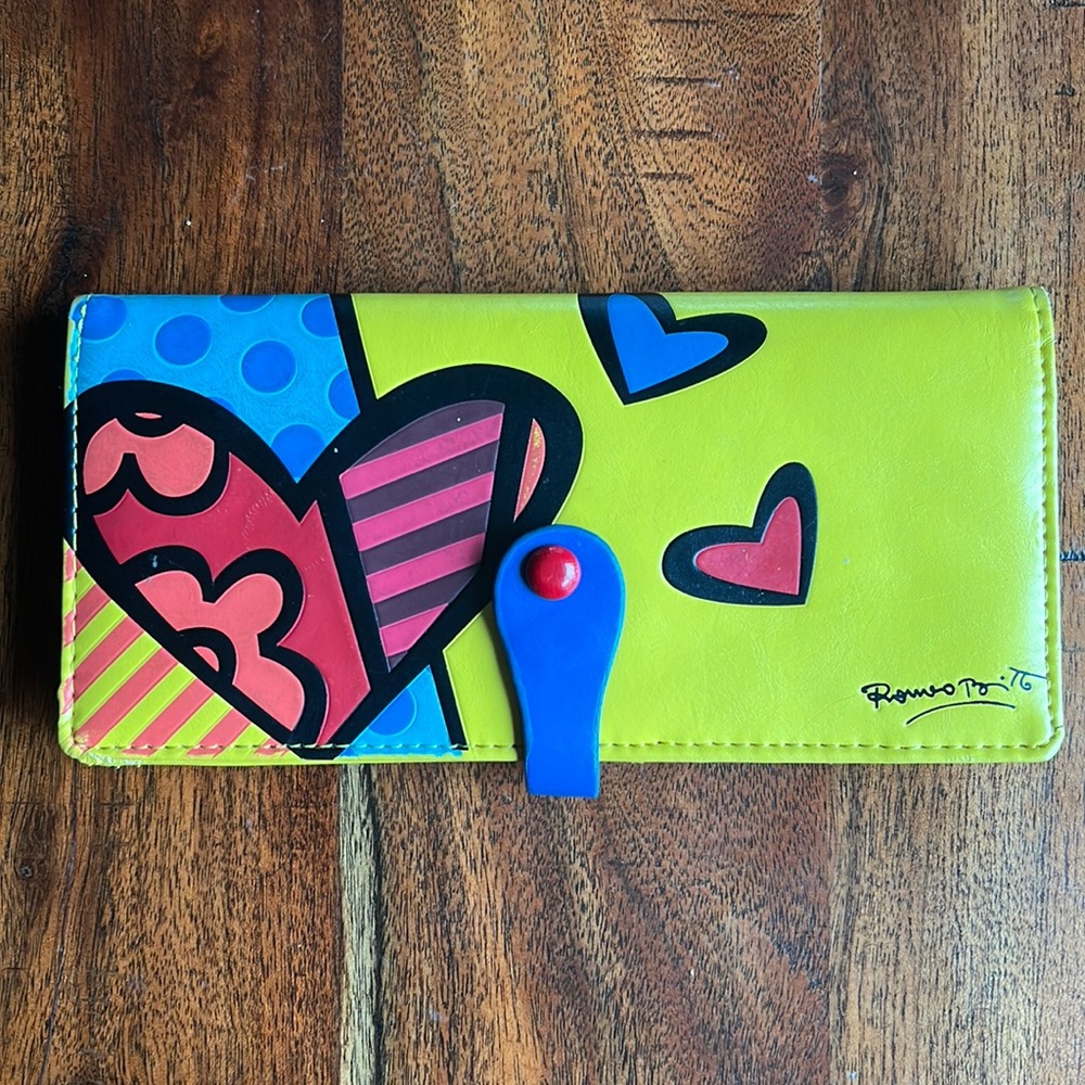 Romero Britto yellow wallet. Slightly used.